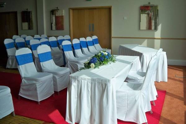 White Chair Covers and Blue Sashes