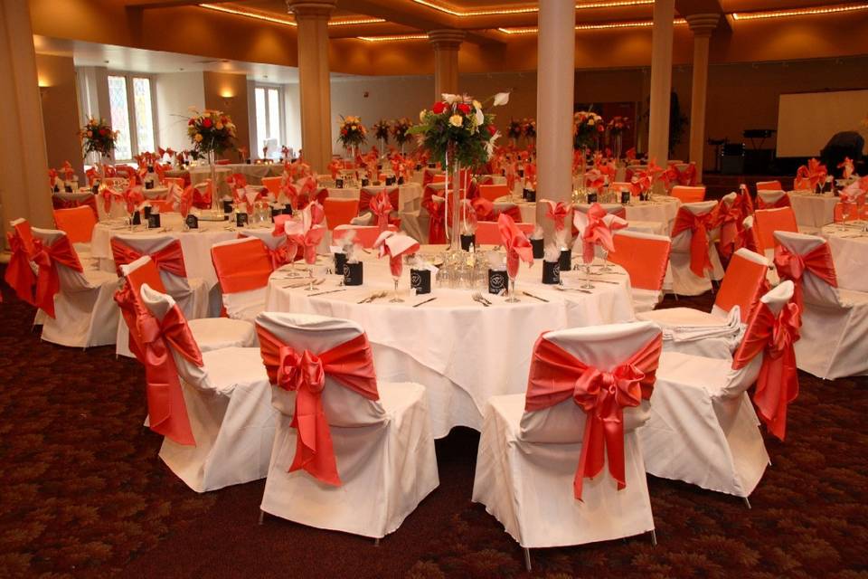 Pink ribbon decor on reception chairs