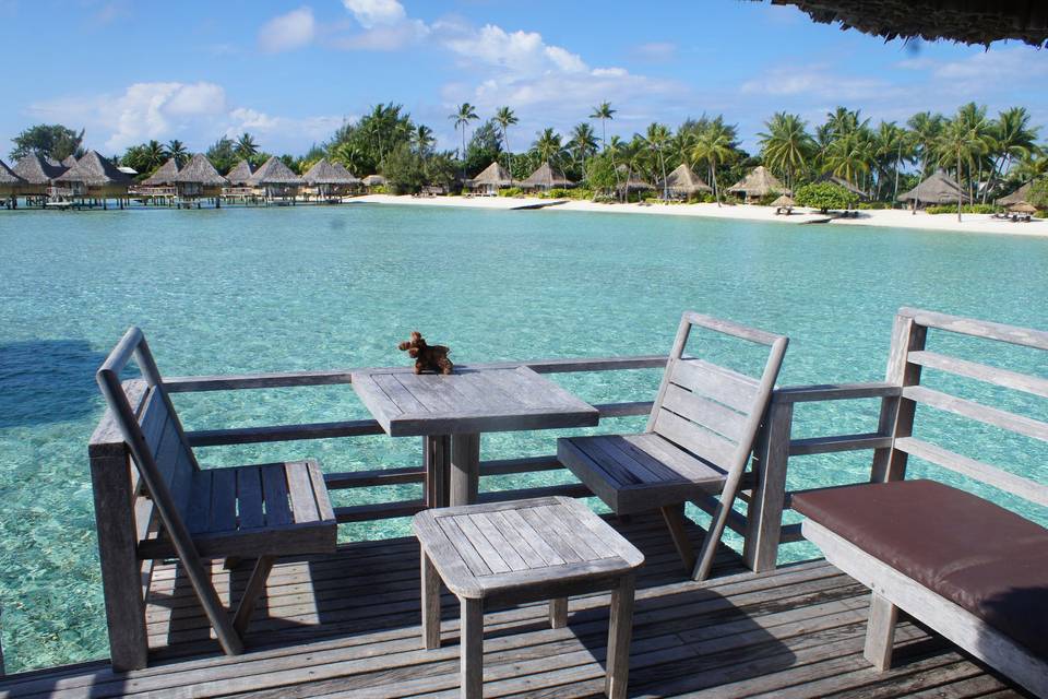 InterContinental Le Moana, overwater bungalow. The deck has 2 benches, table 2 chairs, cocktail table and lower deck that allows easy access to the beautiful lagoon.