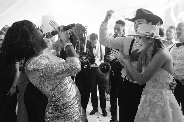 Bride & Groom dancing in hats