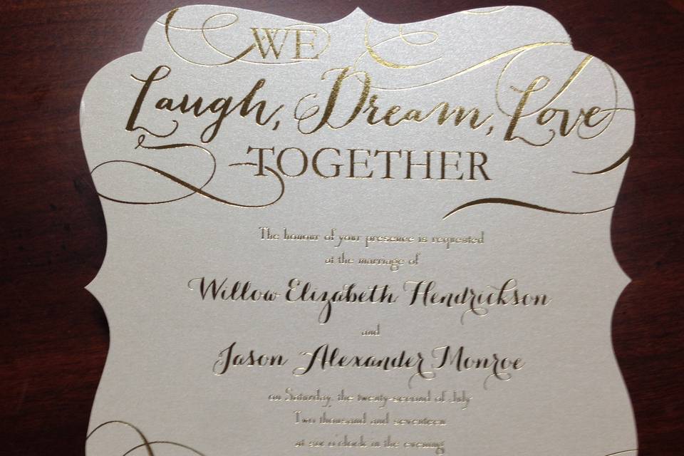 Die cut invitation with gold details.