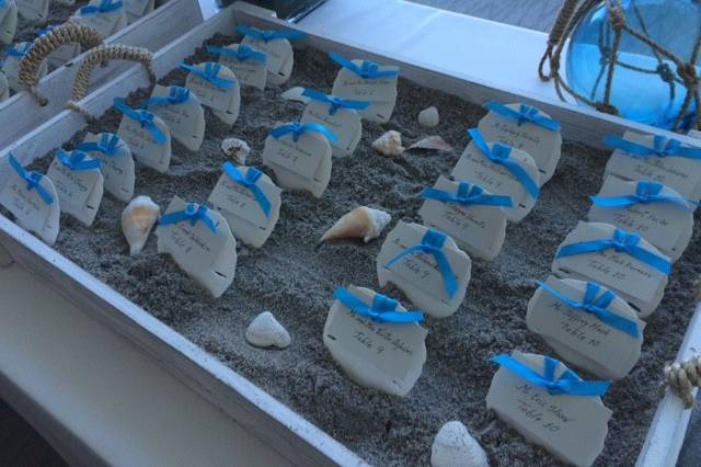 Sand dollar place cards for a wedding at the Waterstone Resort in Boca Raton, Florida.