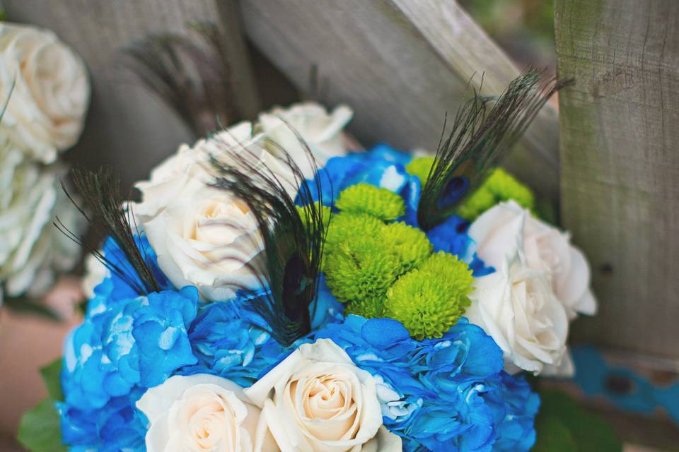 White roses and blue flowers