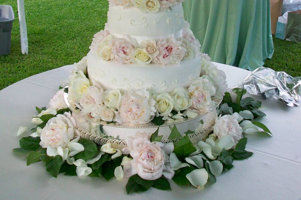 Stacked cake layers with roses in between