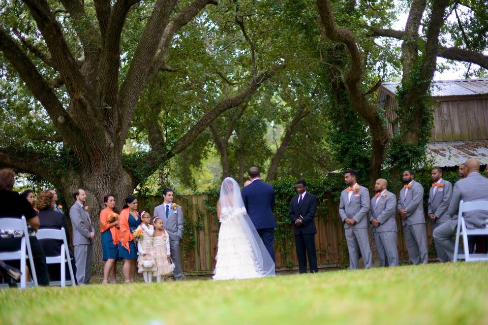 Intimate ceremony under oak trees at the Honey Bee Ranch Event Center.