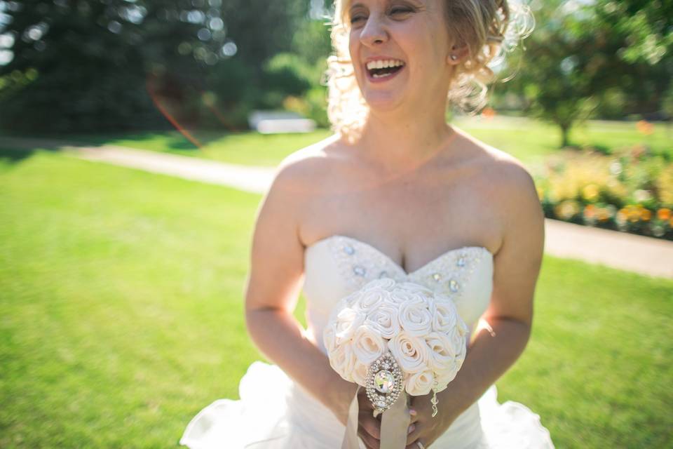 Peacock themed bouquet for this beautiful bride. She provided her brooches. A very special peacock brooch from her aunt graces the handle.