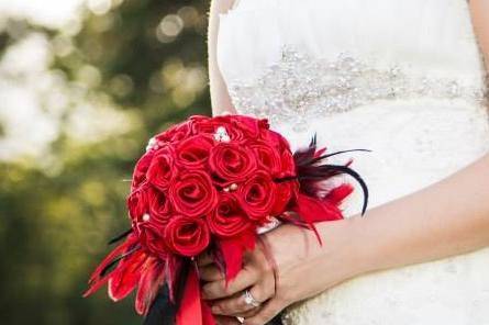 What a sweet bride, Sweet Melissa. Her classic red, black, and white wedding is visually stunning. Her red bouquet was adorned with pearls and feathers.
