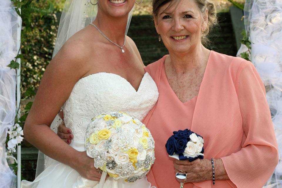 The beautiful bride with her 70 rose bouquet in antique white and lemon.