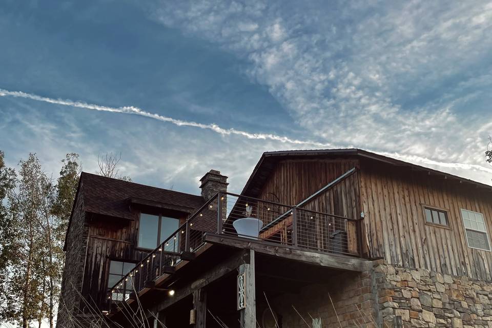 View of barn & stone house