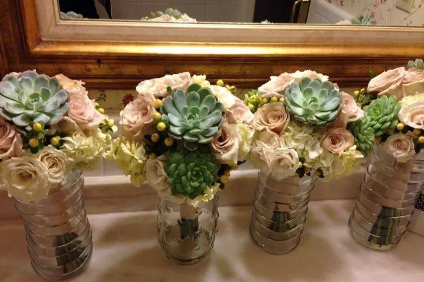 Sahara roses, succulents, dahlias, hypericum berry and champagne ribbon