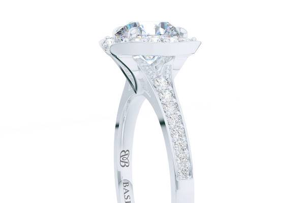 Elegance Personified Bright White Gold or PlatinumUniquely constructed Halo Engagement Ring with contemporary, clean lines. The diamond laced halo crown, accentuates the fire and brilliance of the center stone - our Ex/Ex/Ex graded - G/VS1  Round Brilliant GIA Certified, Conflict Free Diamond. Our signature 
