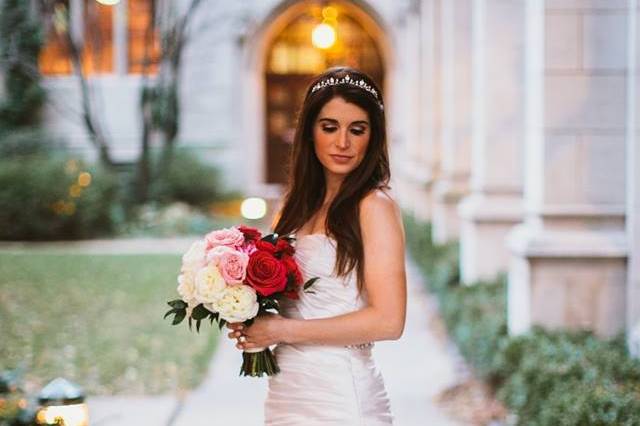 Holding a bouquet with pink flowers