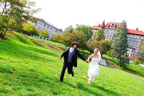 a couple running in a field in Philadelphia