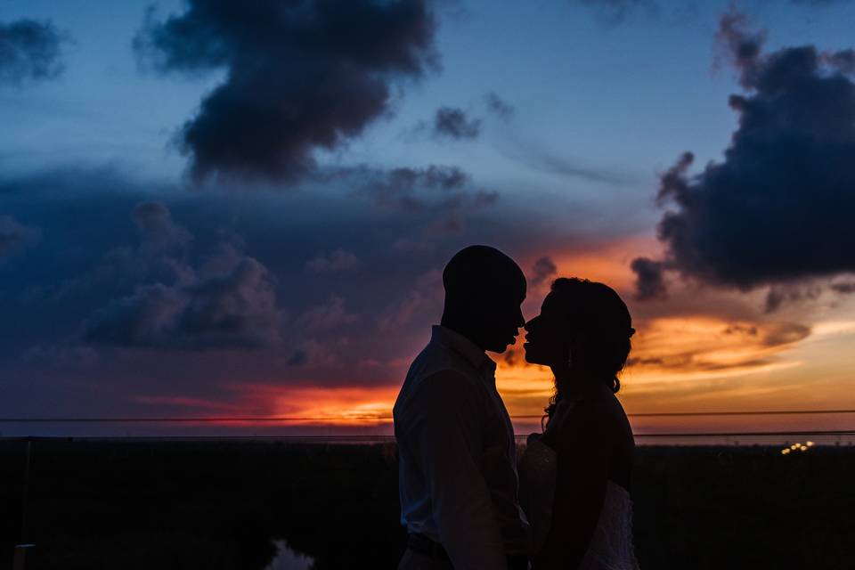 Couple backlit by the sunset