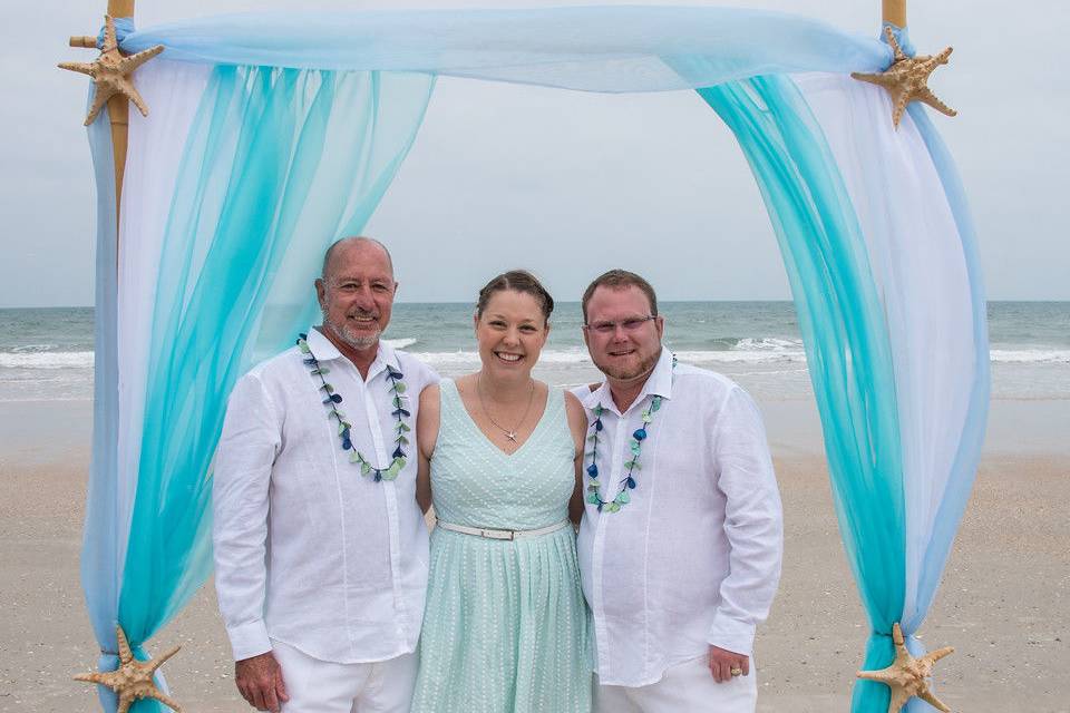 Officiant and the grooms