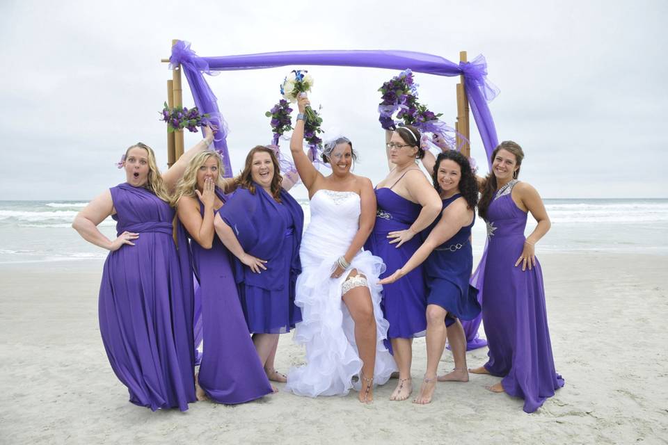 Bride and her bridesmaids in violet