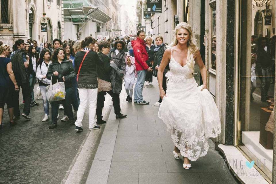 Bride going to the church through the ancient streets of Rome