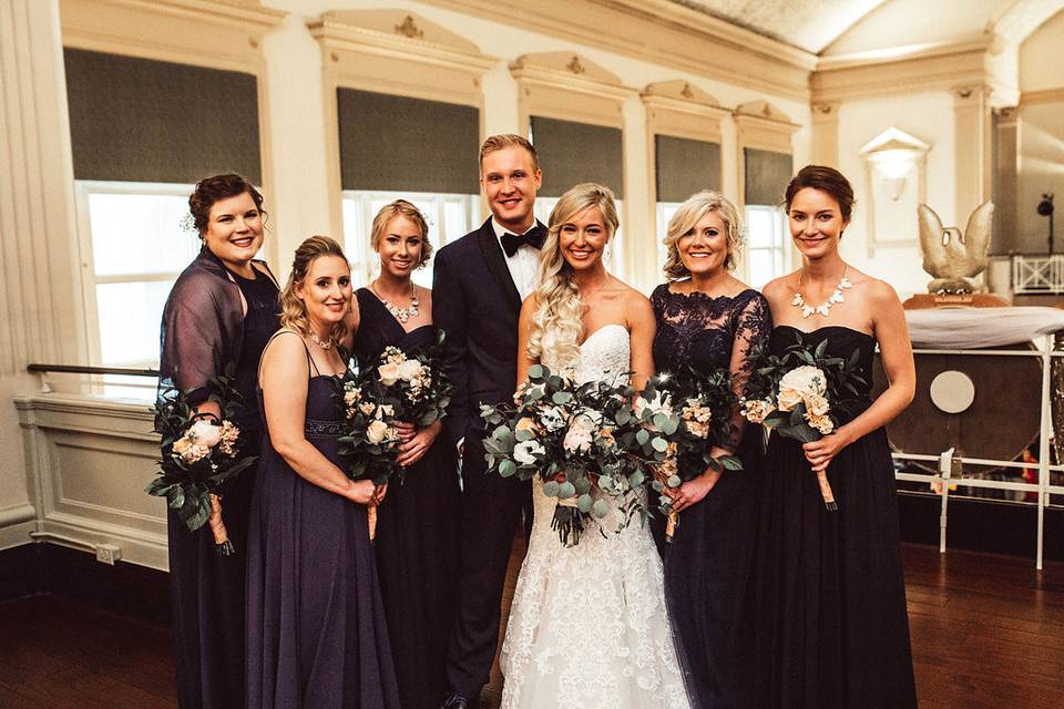 Bride and groom with their bridal party in the VIP