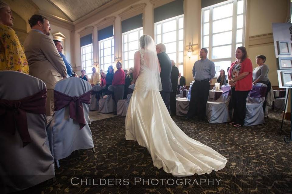 Father and daughter walking down the aisle