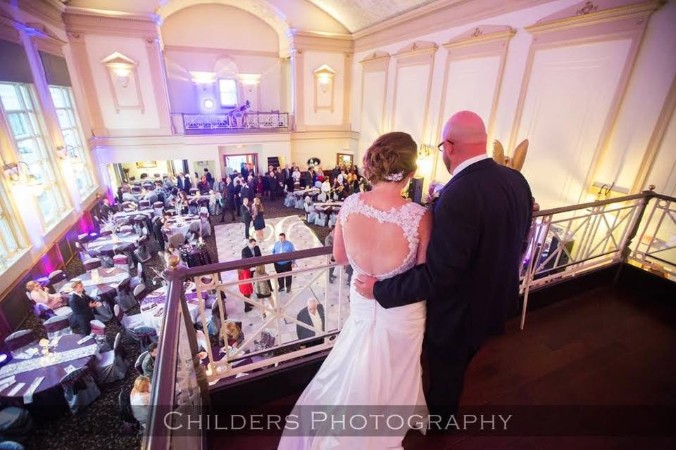 The newlyweds looking from the VIP balcony