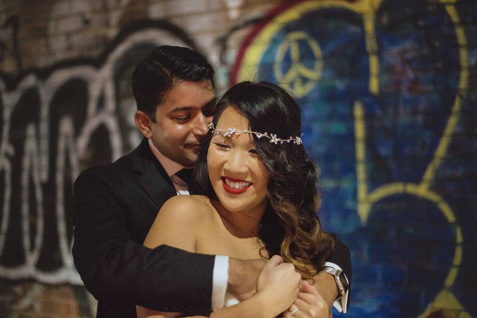 Groom hugging his bride