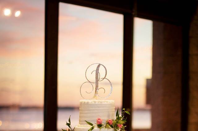 Cake table water in background