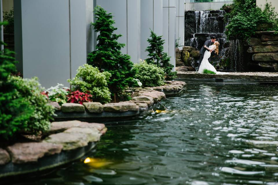 Kissing by the waterfall