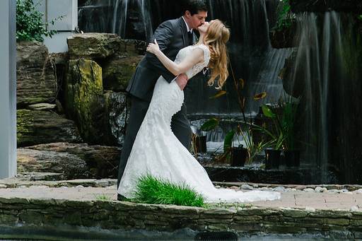 Couple kissing by waterfall