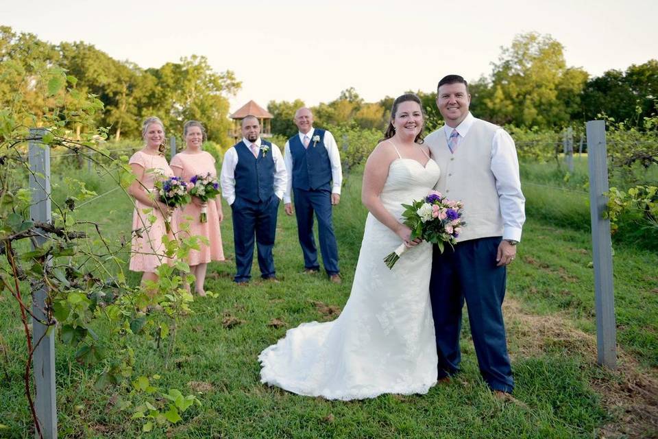 The couple with the bridesmaids and groomsmen