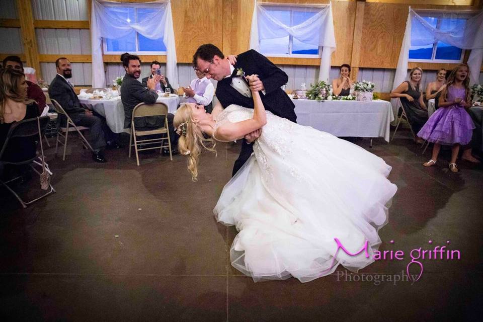 Groom dancing with bride