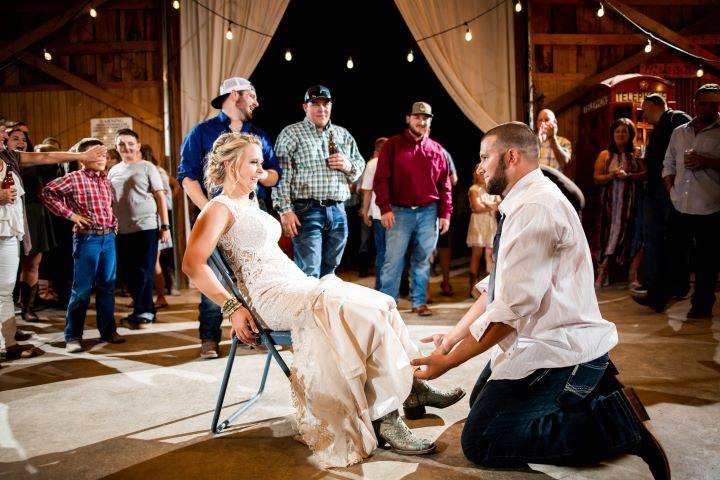 Groom removes the garter