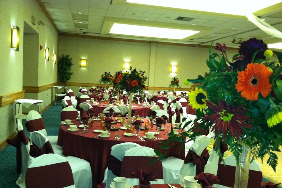 Reception tables and red decor