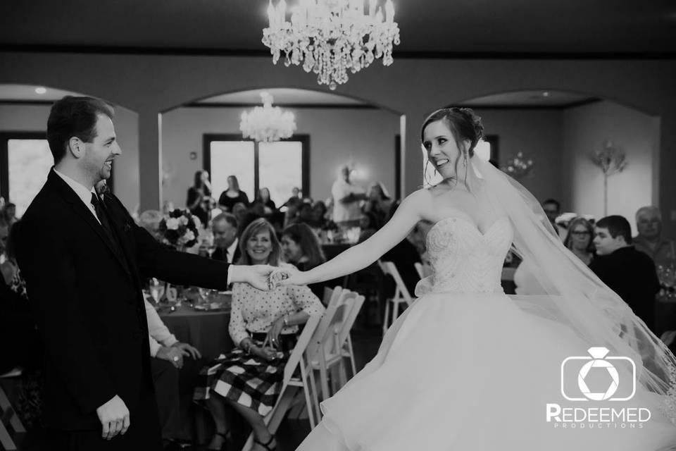 Newlyweds dance in black and white