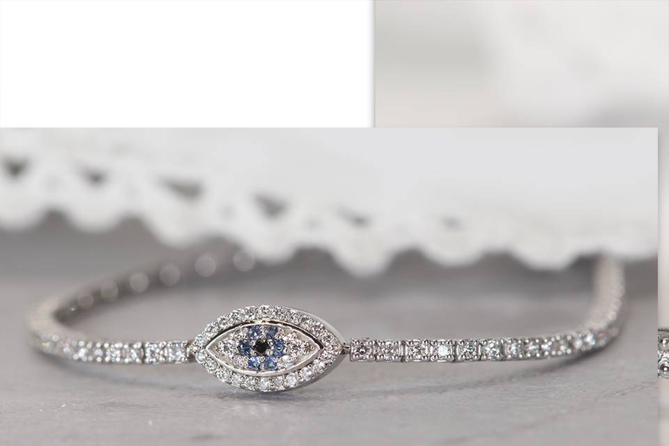 Tennis-bracelet-with-eye-and-blue-sapphires_01.png