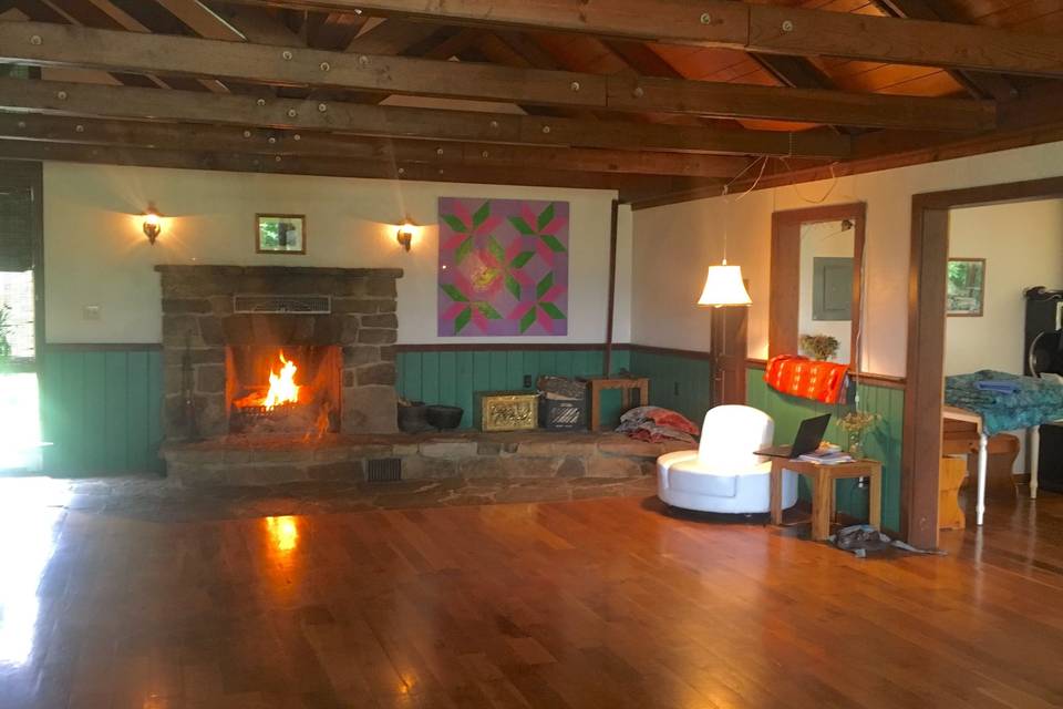 A cheerful fire takes the chill off of a cool night. The great room is a good place to dance, hear live music, and seat additional guests.