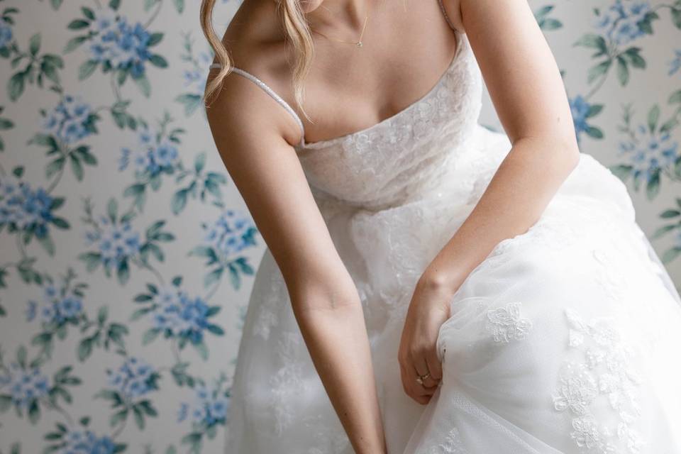 Bride putting on shoes