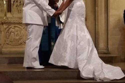 Elegant bilingual wedding in the Nave at The Riverside Church. Ritual: Passing of the Peace and Arras 13 coins. Entire family very welcoming and involved in ceremony.