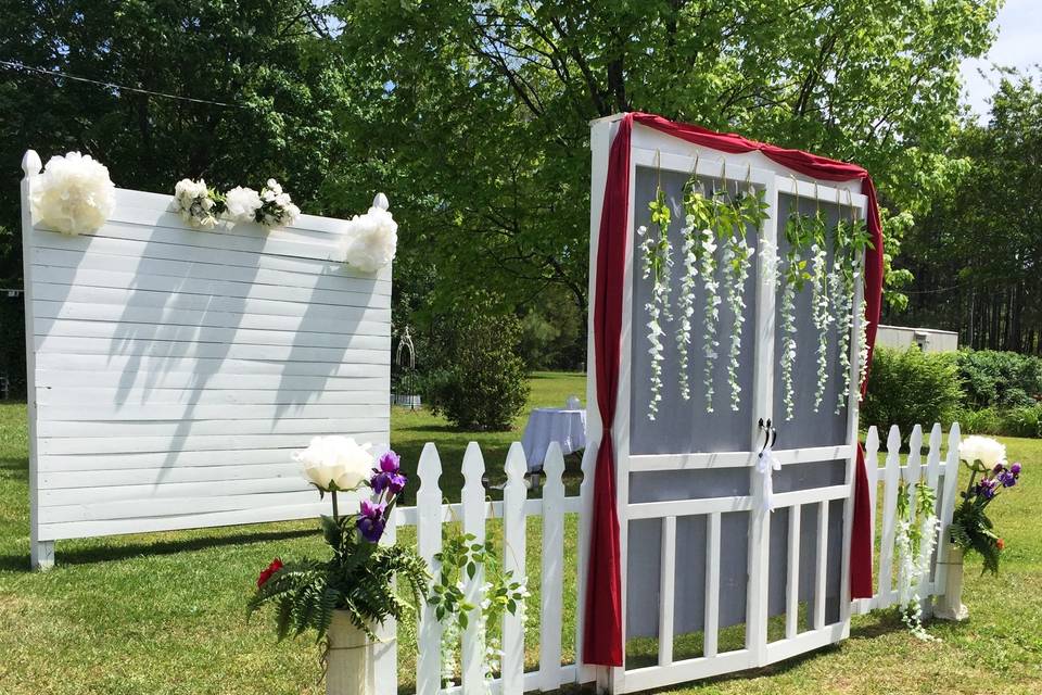 Bridal grand entrance doors and backdrop decorated with the couples wedding colours.