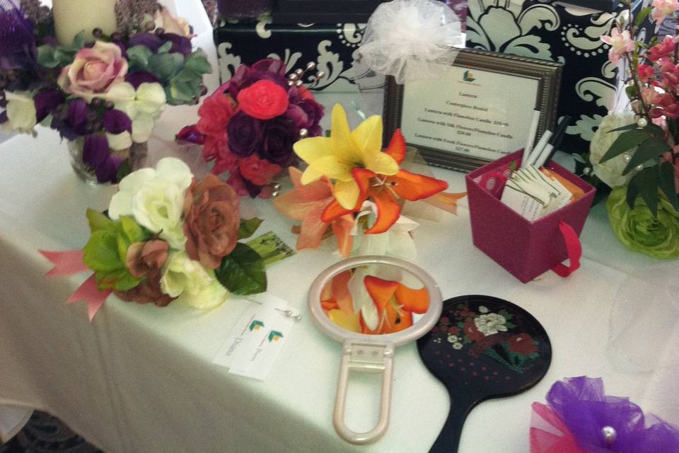 This is one of the tables we set up for the ITAM Berkshire Bride Hair and Makeup Show. We have several hair pieces and rental lanterns shown in this photo.