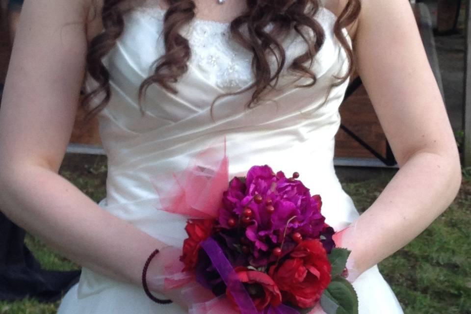 This bride is shown posing with her FREE toss away bouquet!