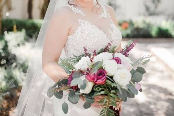 Bride is wearing Essense of Australia gown, 2215! Styled by Ivory & Lace Bridals. Photographer: Carography Studios