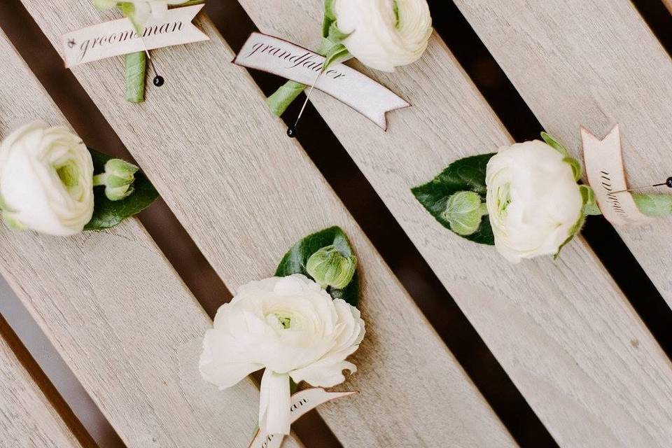 Simple ranunculus boutonnières with style