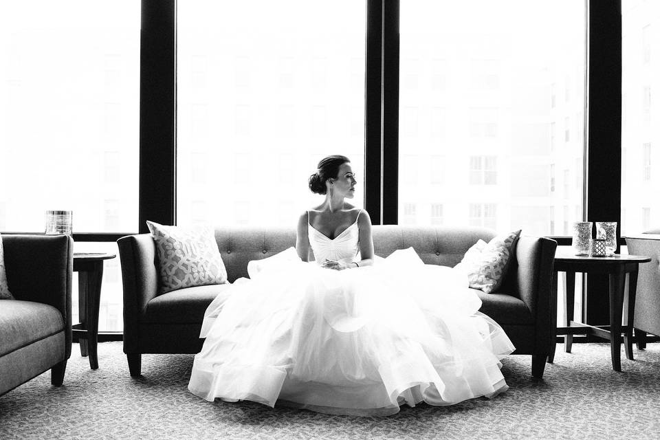 Bride sitting at A'Bulae in St. Paul, MN before the ceremony