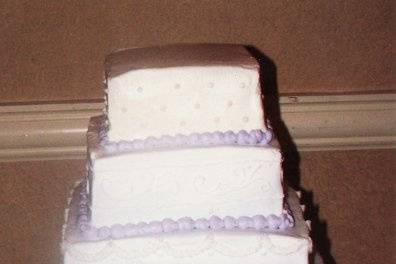 Gradation of the purple color makes this cake special.  Each layer has a different design on it that is simple yet elegant.