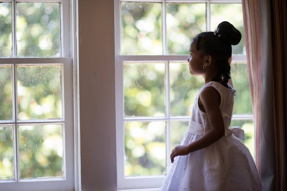 Flower girl by the window