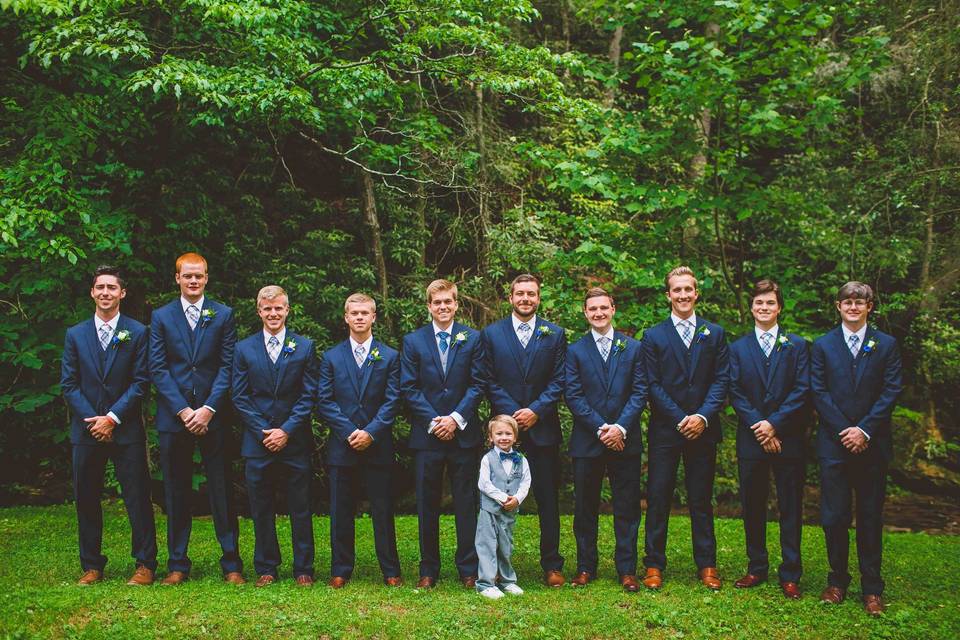 The groom with his groomsmen and page boy