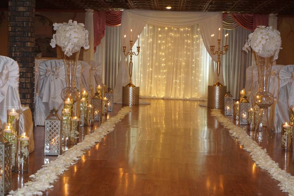 Candlelit aisle and floral decor