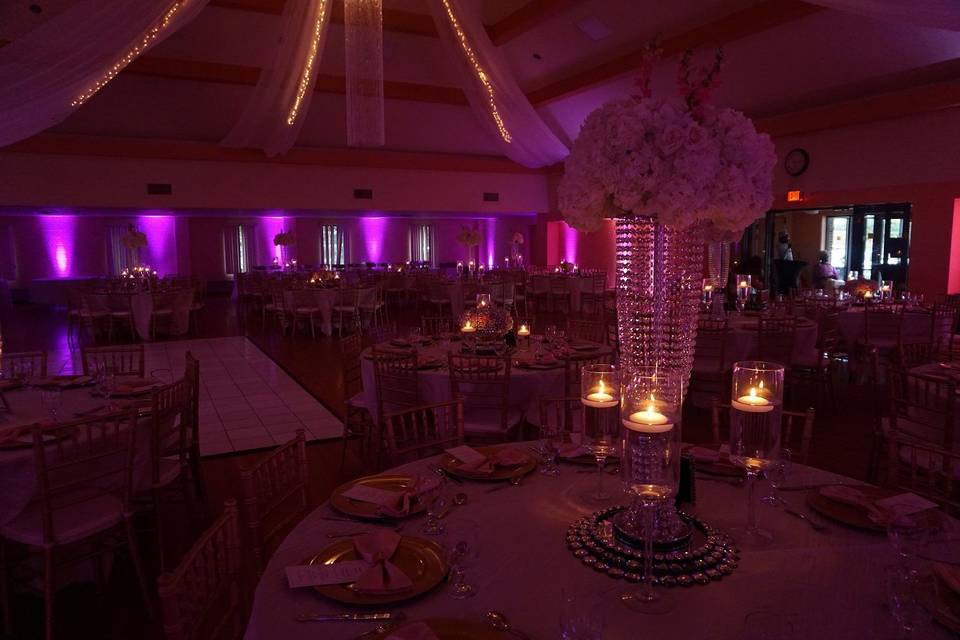 Raised floral centerpiece and candle lights