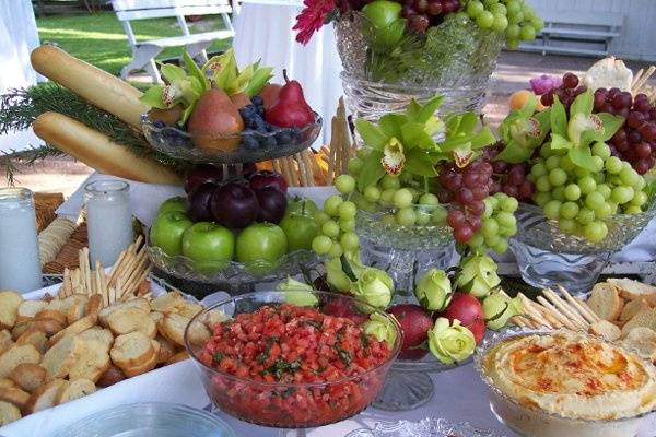 Creative presentation of Bruschetta Toppings and Cheese & Fruit Display.