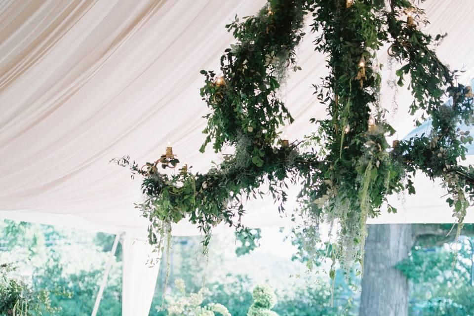 Chandelier installation with greenery and Spanish moss.